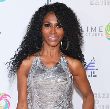 person wearing a sequined dress at a promotional event