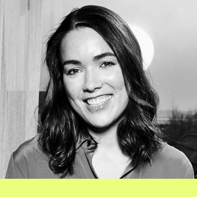 a person with mediumlength dark hair is captured in a monochromatic setting