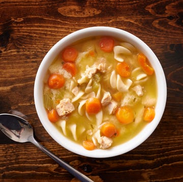 bowl of chicken noodle soup shot top down