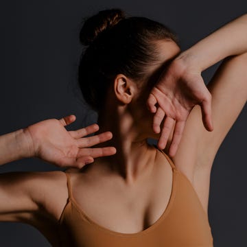 beautiful dancer posing on a studio background