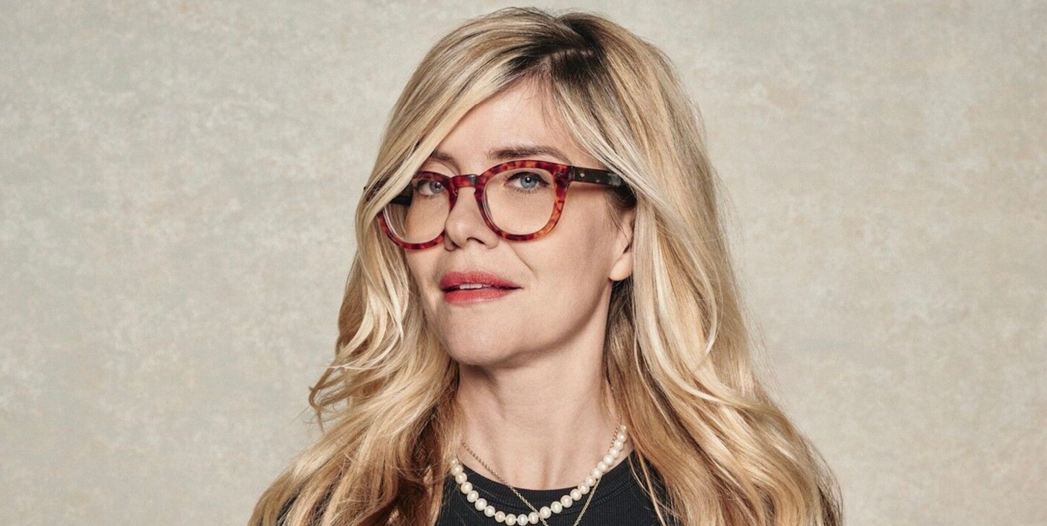 a person holding a kettlebell wearing casual athletic clothing