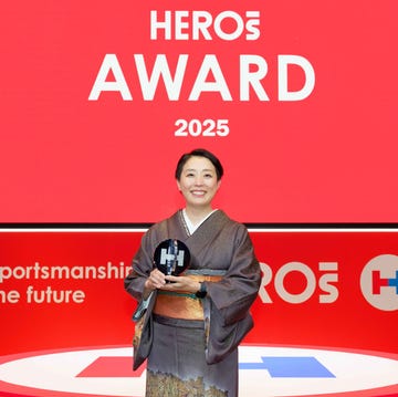 individual holding an award at a ceremony