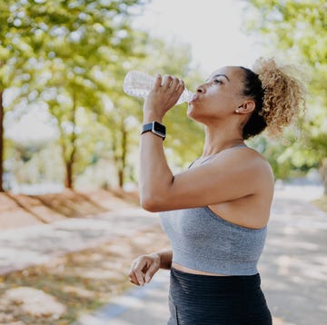 fitness runner woman drinking water