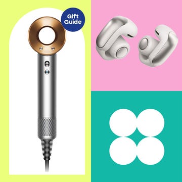 collection of gift items including slippers a hair dryer wireless earbuds and a foot massager