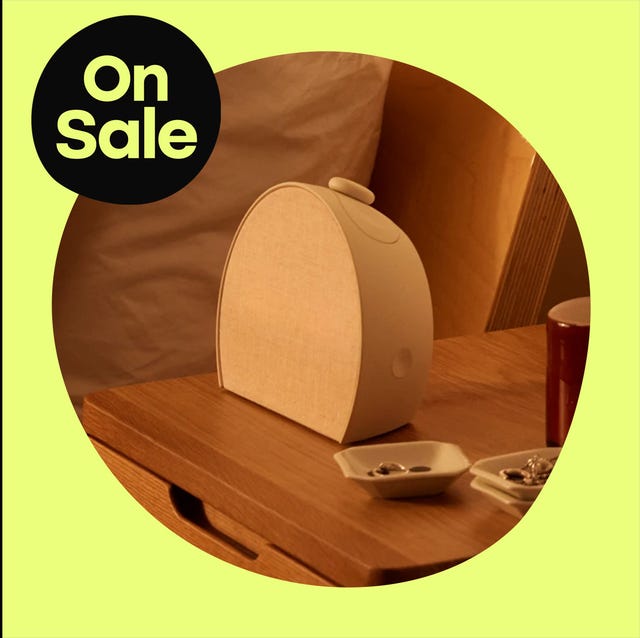 a stylish speaker displayed on a table highlighting a promotional on sale banner