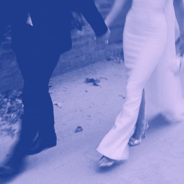 couple walking hand in hand showcasing a wedding theme