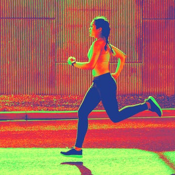 person running outdoors along a paved surface