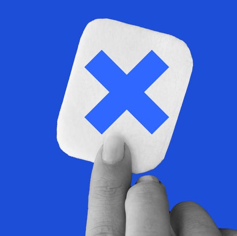 sign with a blue x symbol on a contrasting background