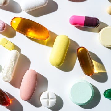 a lot of colorful medication pills capsules tablets softgel supplements, fish oil, vitamin, omega 3