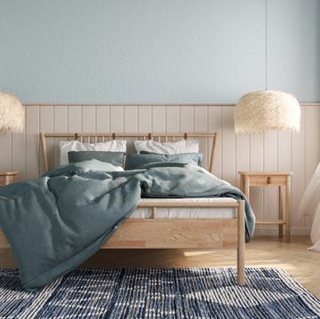 coastal bedroom design with wooden bed furniture, blue walls and wood panelling. interior mockup. 3d rendering.