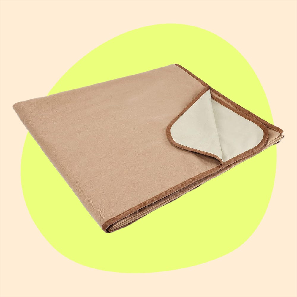 a beige mat folded on the left and a maroon teardropshaped item on the right