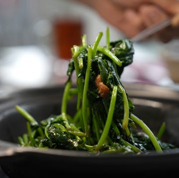 stir fried sweet potato leaves in clay pot with pork lard