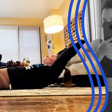 individual performing a stretching exercise in a home setting