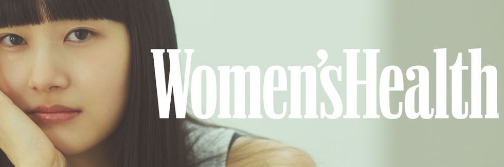 womens health magazine title with a blurred face in the background