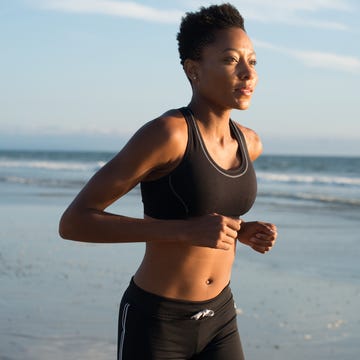 woman runs on the beach