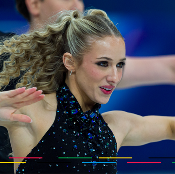 figure skaters performing on the ice with expressive arm movements