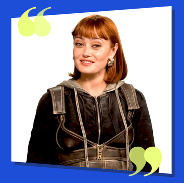 person wearing a hooded jacket with a unique design